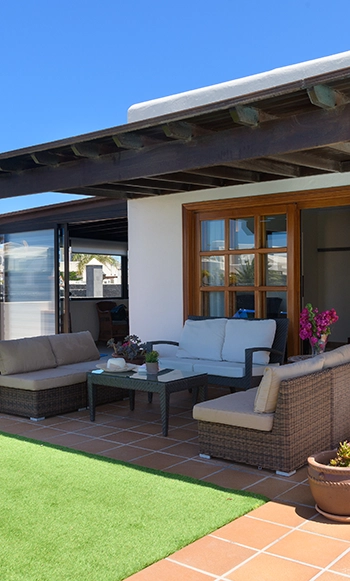 Terrace under a wooden pergola at Villa Aguamarina 29 Covered terrace with wooden pergola and furniture at Hipoclub Villa Aguamarina 29
